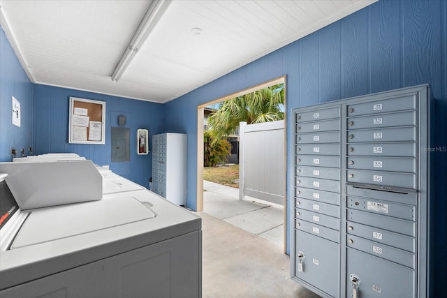 clothes washing area featuring washer / clothes dryer and electric panel