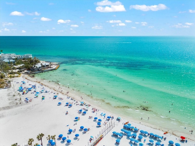 drone / aerial view with a water view and a view of the beach
