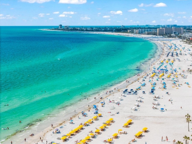bird's eye view with a water view and a view of the beach
