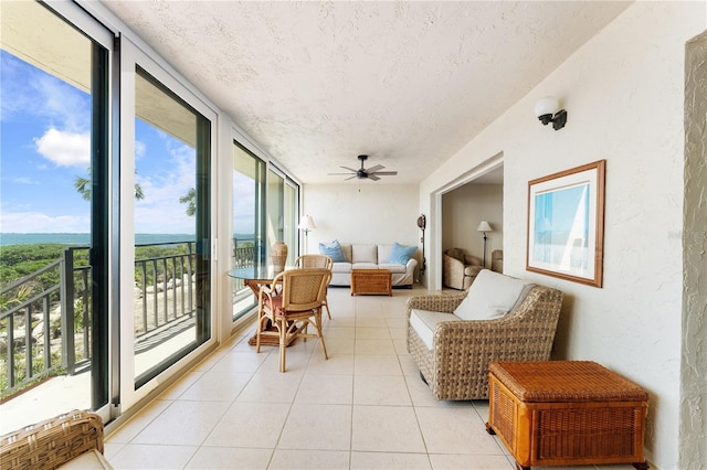 6460 Mourning Dove Dr Unit 102, Bradenton, FL 34210 - sunroom featuring a textured ceiling, healthy amount of natural light, tile patterned floors, and a textured wall