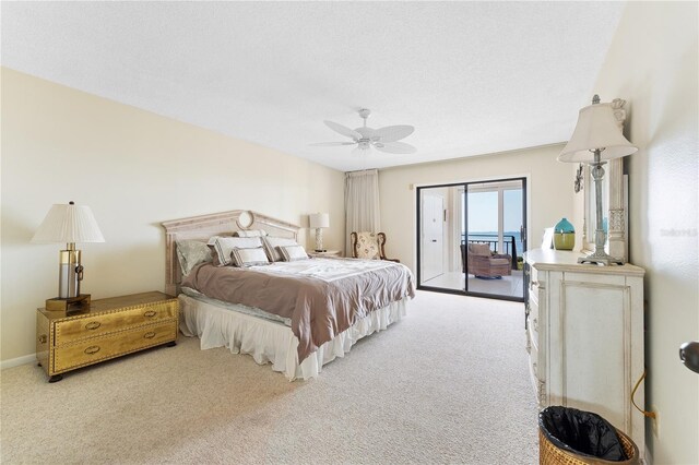 6460 Mourning Dove Dr Unit 102, Bradenton, FL 34210 - carpeted bedroom with access to exterior and ceiling fan