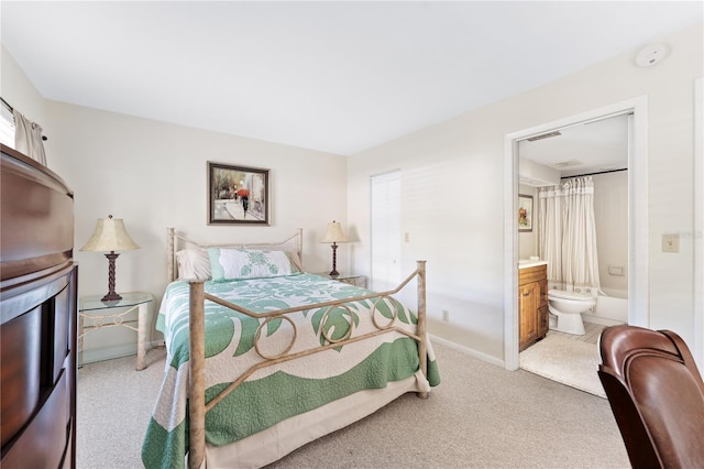 6460 Mourning Dove Dr Unit 102, Bradenton, FL 34210 - bedroom with carpet flooring, baseboards, and ensuite bath