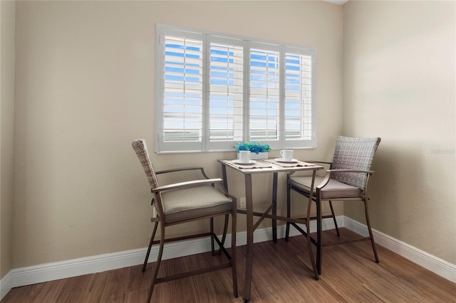 dining area with wood finished floors and baseboards