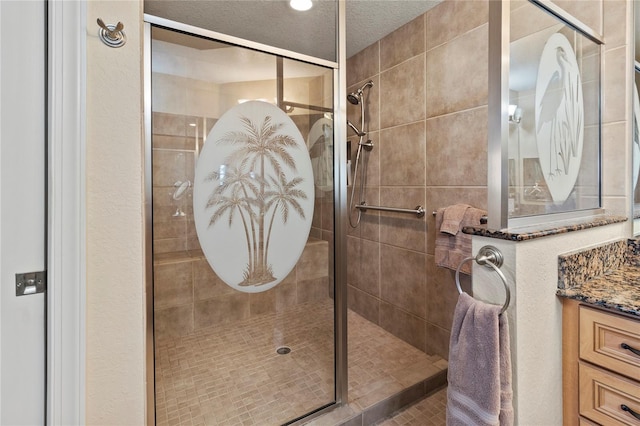 full bathroom featuring vanity and a stall shower