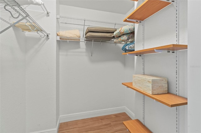 spacious closet with wood finished floors