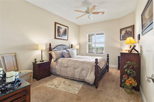 bedroom with baseboards, light carpet, and ceiling fan