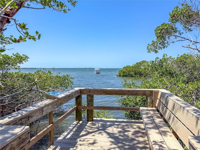 wooden deck featuring a water view