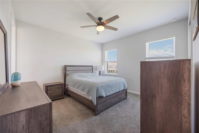 bedroom featuring baseboards, carpet flooring, and ceiling fan