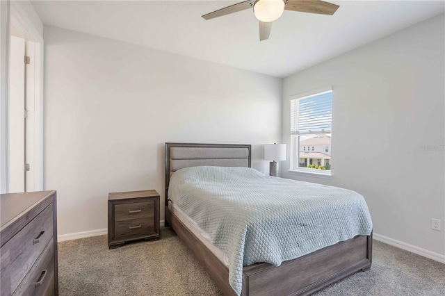 bedroom featuring carpet flooring, baseboards, and a ceiling fan