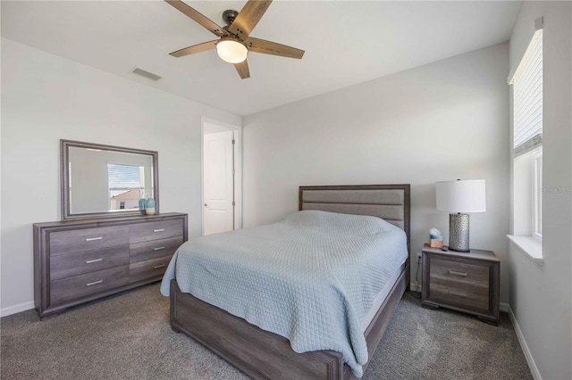 bedroom featuring carpet, visible vents, baseboards, and ceiling fan