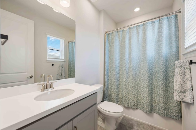 bathroom featuring a shower with curtain, vanity, recessed lighting, and toilet