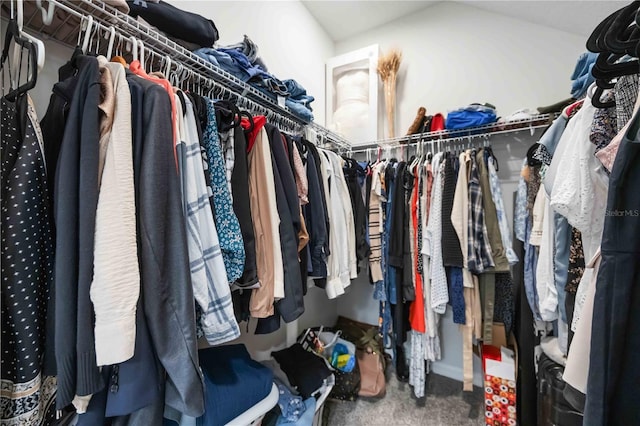 spacious closet with carpet flooring