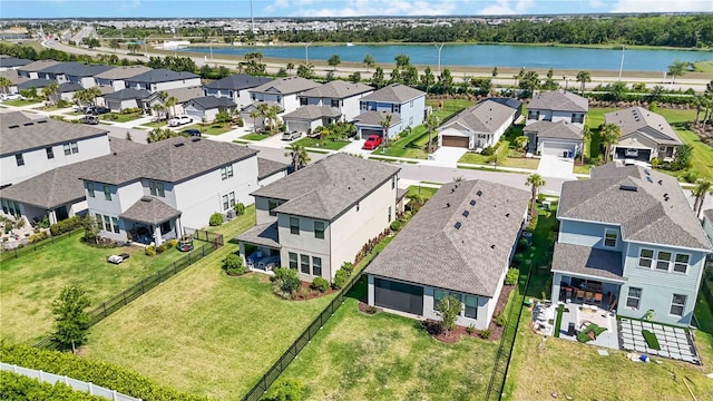 aerial view featuring a residential view and a water view