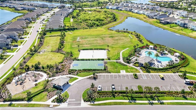 aerial view with a residential view and a water view