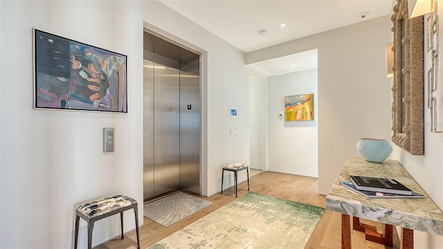 280 Golden Gate Pt Unit 600, Sarasota, FL 34236 - hall with elevator and wood finished floors