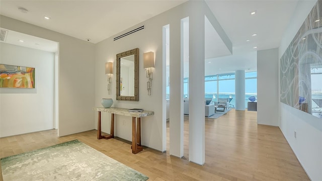 280 Golden Gate Pt Unit 600, Sarasota, FL 34236 - corridor featuring light wood-style floors and visible vents
