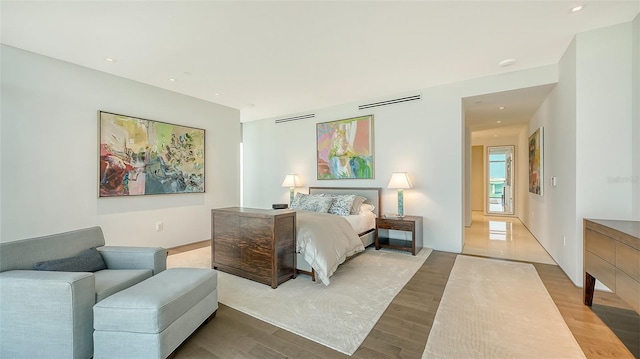 280 Golden Gate Pt Unit 600, Sarasota, FL 34236 - bedroom with visible vents, wood finished floors, and recessed lighting