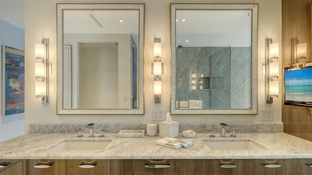 280 Golden Gate Pt Unit 600, Sarasota, FL 34236 - bathroom with double vanity, a shower, and a sink