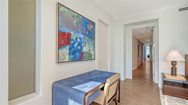 280 Golden Gate Pt Unit 600, Sarasota, FL 34236 - hallway featuring light wood finished floors and visible vents