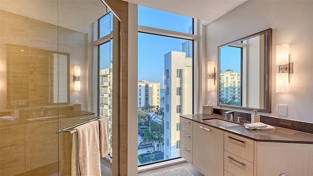 280 Golden Gate Pt Unit 600, Sarasota, FL 34236 - bathroom featuring a stall shower and vanity