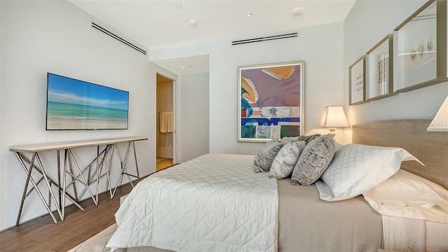 280 Golden Gate Pt Unit 600, Sarasota, FL 34236 - bedroom featuring visible vents and wood finished floors