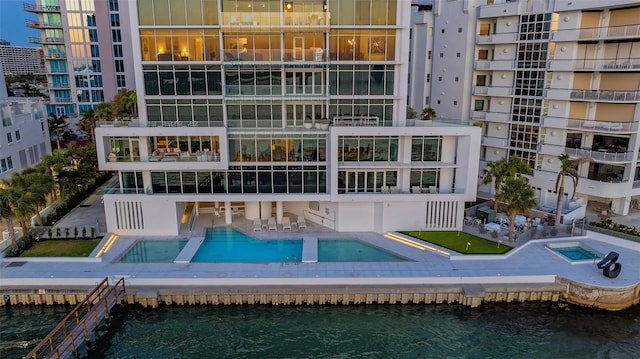 280 Golden Gate Pt Unit 600, Sarasota, FL 34236 - exterior space featuring a water view and a community pool