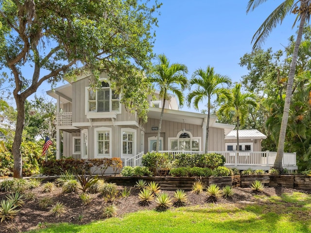 8871 Fishermens Bay Dr, Sarasota, FL 34231 - back of property featuring board and batten siding