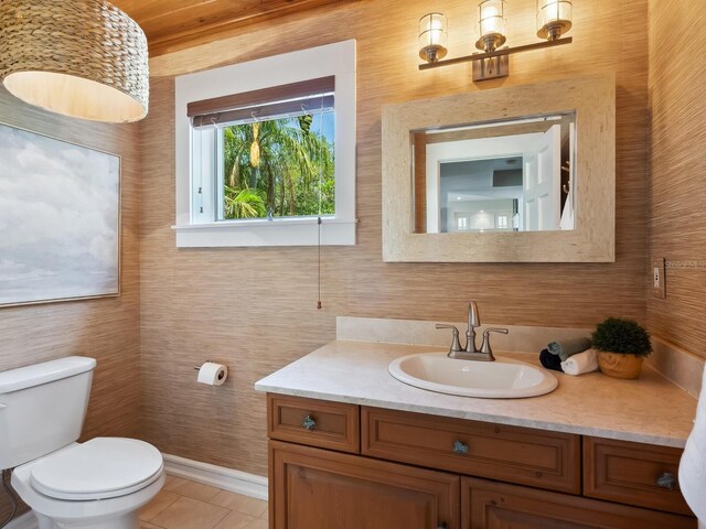 8871 Fishermens Bay Dr, Sarasota, FL 34231 - bathroom featuring tile patterned floors, vanity, and toilet