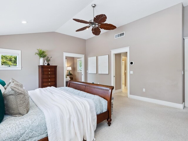 8871 Fishermens Bay Dr, Sarasota, FL 34231 - bedroom with light colored carpet, ceiling fan, baseboards, visible vents, and lofted ceiling