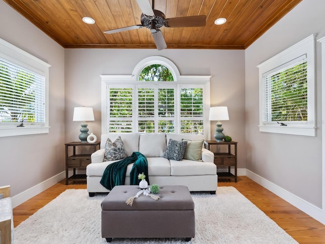 8871 Fishermens Bay Dr, Sarasota, FL 34231 - living room featuring plenty of natural light, ornamental molding, recessed lighting, and baseboards