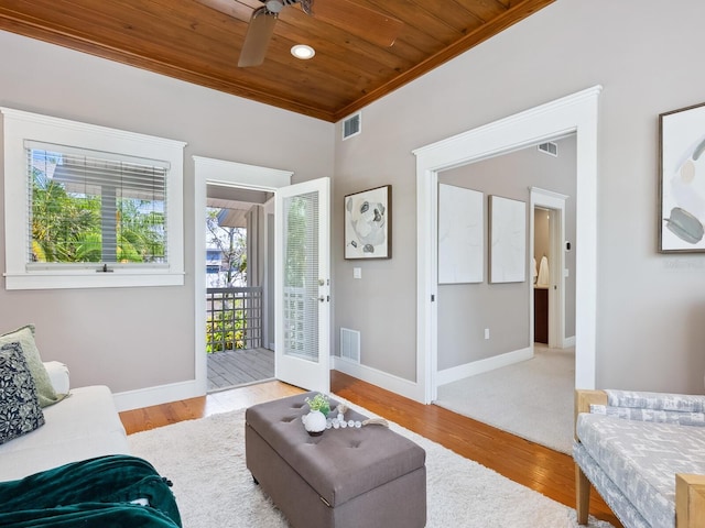 8871 Fishermens Bay Dr, Sarasota, FL 34231 - living room featuring crown molding, a ceiling fan, visible vents, and wood ceiling