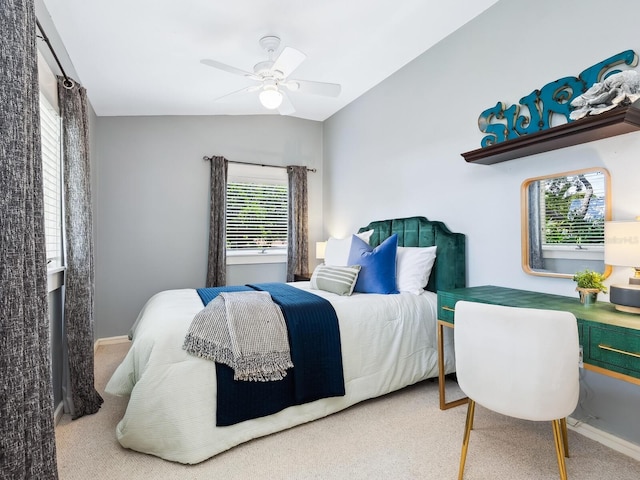 8871 Fishermens Bay Dr, Sarasota, FL 34231 - carpeted bedroom featuring lofted ceiling, a ceiling fan, and baseboards