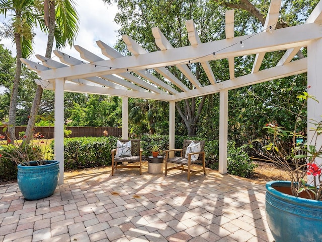8871 Fishermens Bay Dr, Sarasota, FL 34231 - view of patio / terrace featuring fence and a pergola