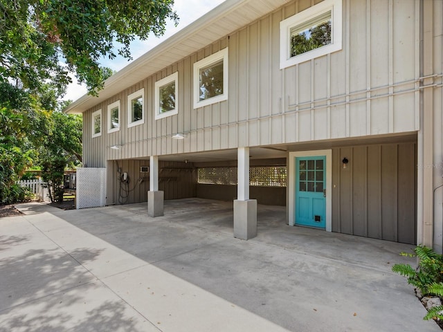 8871 Fishermens Bay Dr, Sarasota, FL 34231 - view of front of property featuring a carport and board and batten siding