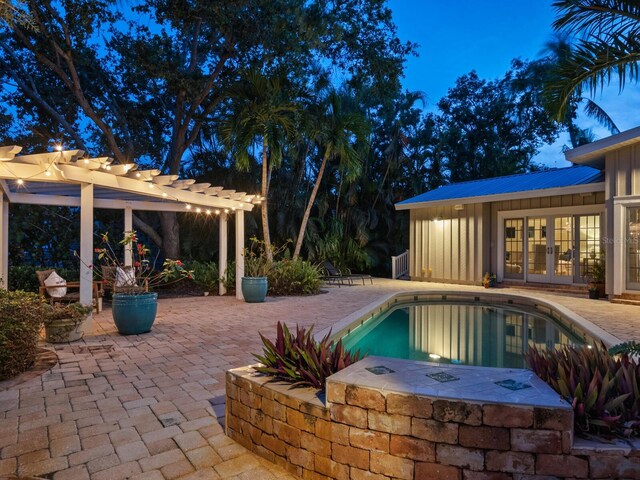 8871 Fishermens Bay Dr, Sarasota, FL 34231 - pool featuring a pergola, a patio area, and french doors