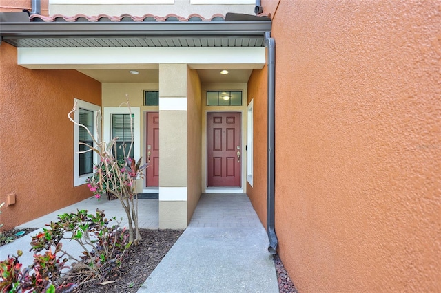 288 Crew Ct, Sarasota, FL 34243 - property entrance featuring stucco siding