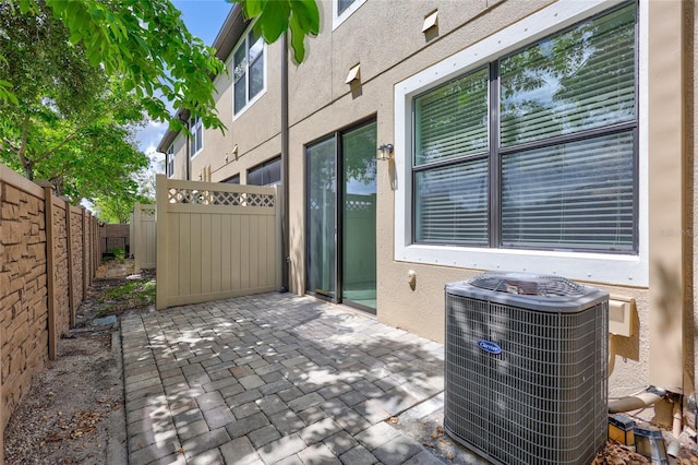 288 Crew Ct, Sarasota, FL 34243 - view of patio / terrace featuring a fenced backyard and cooling unit