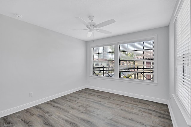 288 Crew Ct, Sarasota, FL 34243 - empty room with baseboards, ceiling fan, and wood finished floors