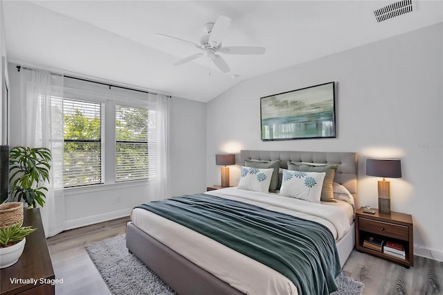 288 Crew Ct, Sarasota, FL 34243 - bedroom with visible vents, lofted ceiling, wood finished floors, baseboards, and a ceiling fan