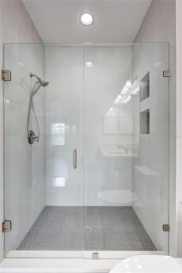288 Crew Ct, Sarasota, FL 34243 - bathroom with recessed lighting, a stall shower, and toilet