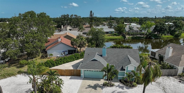 aerial perspective of suburban area with a large body of water