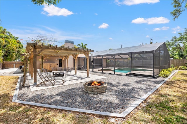 view of community with a pergola, a fenced backyard, a pool, a patio area, and an outdoor fire pit