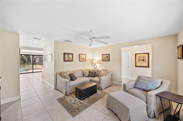 living room with light tile patterned floors, baseboards, a ceiling fan, and visible vents