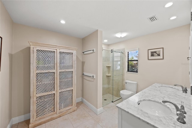 bathroom with a sink, a stall shower, toilet, and visible vents