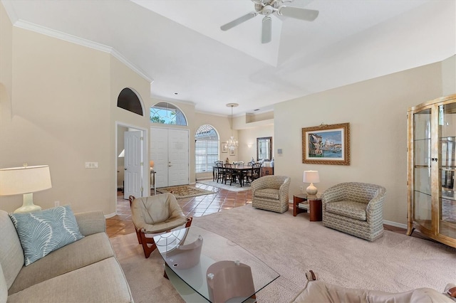 carpeted living room with ceiling fan, crown molding, baseboards, a chandelier, and tile patterned flooring