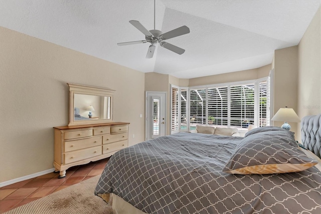bedroom featuring tile patterned floors, baseboards, a ceiling fan, access to outside, and vaulted ceiling