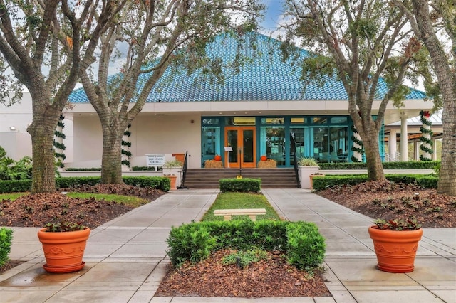 view of front of home with french doors and stucco siding