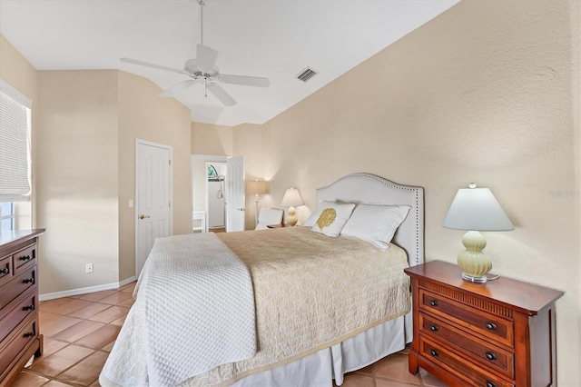 bedroom with light tile patterned floors and a ceiling fan