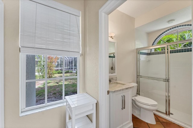 full bath featuring healthy amount of natural light, toilet, and a stall shower