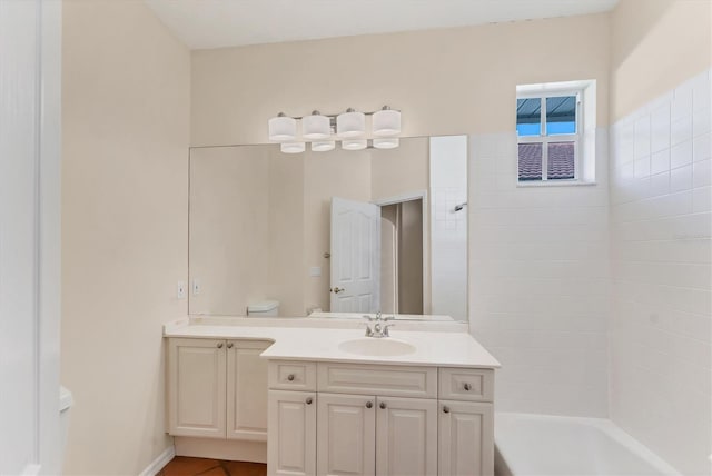 full bathroom with toilet, vanity, and tub / shower combination